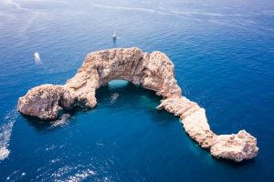 Aerial drone still image capturing 'The Gates of Heaven' in the Balearic sea close to Ibiza. photo by michael tomlinson on unsplash